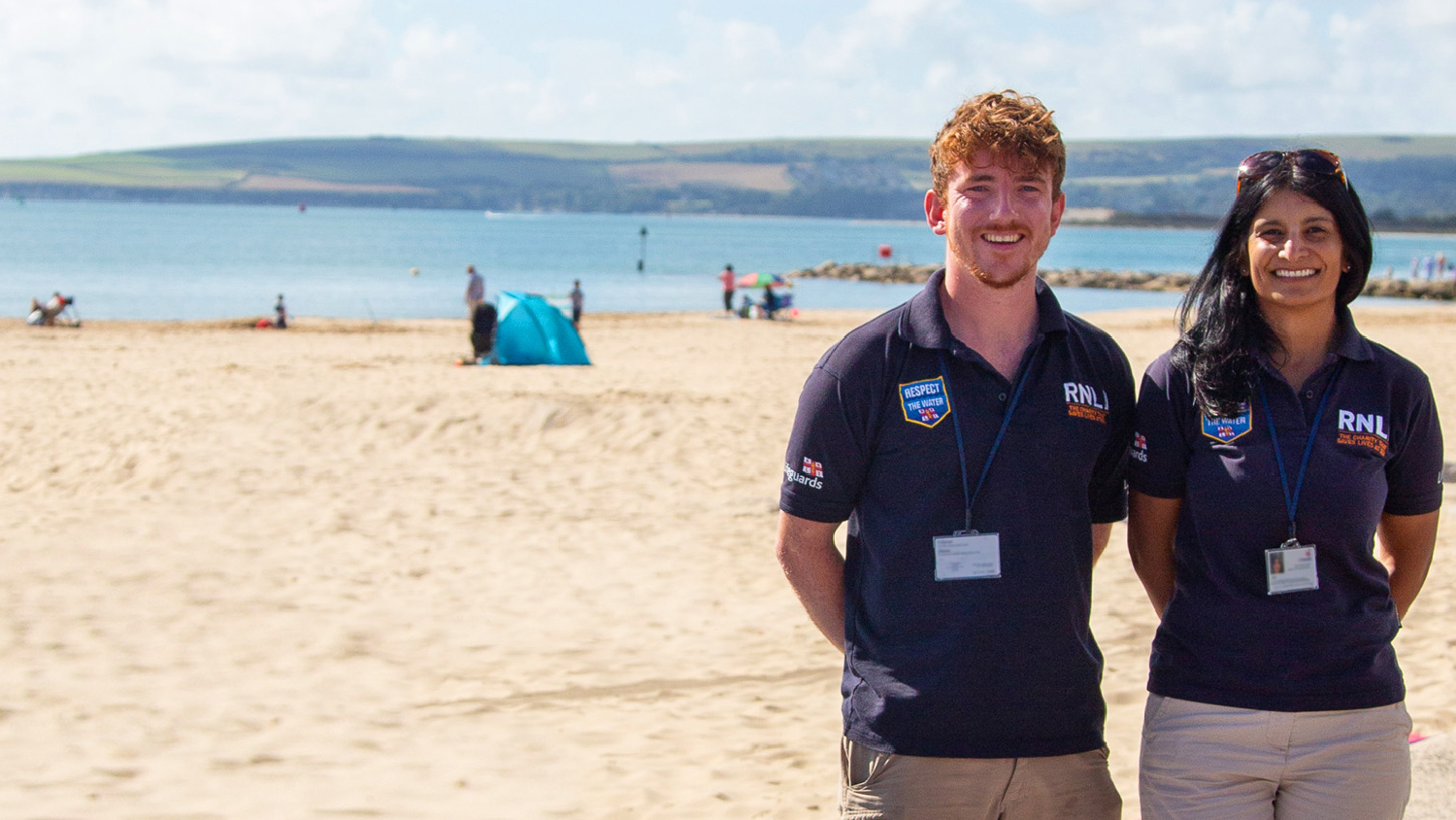 Two RNLI face to face fundraisers on a beach